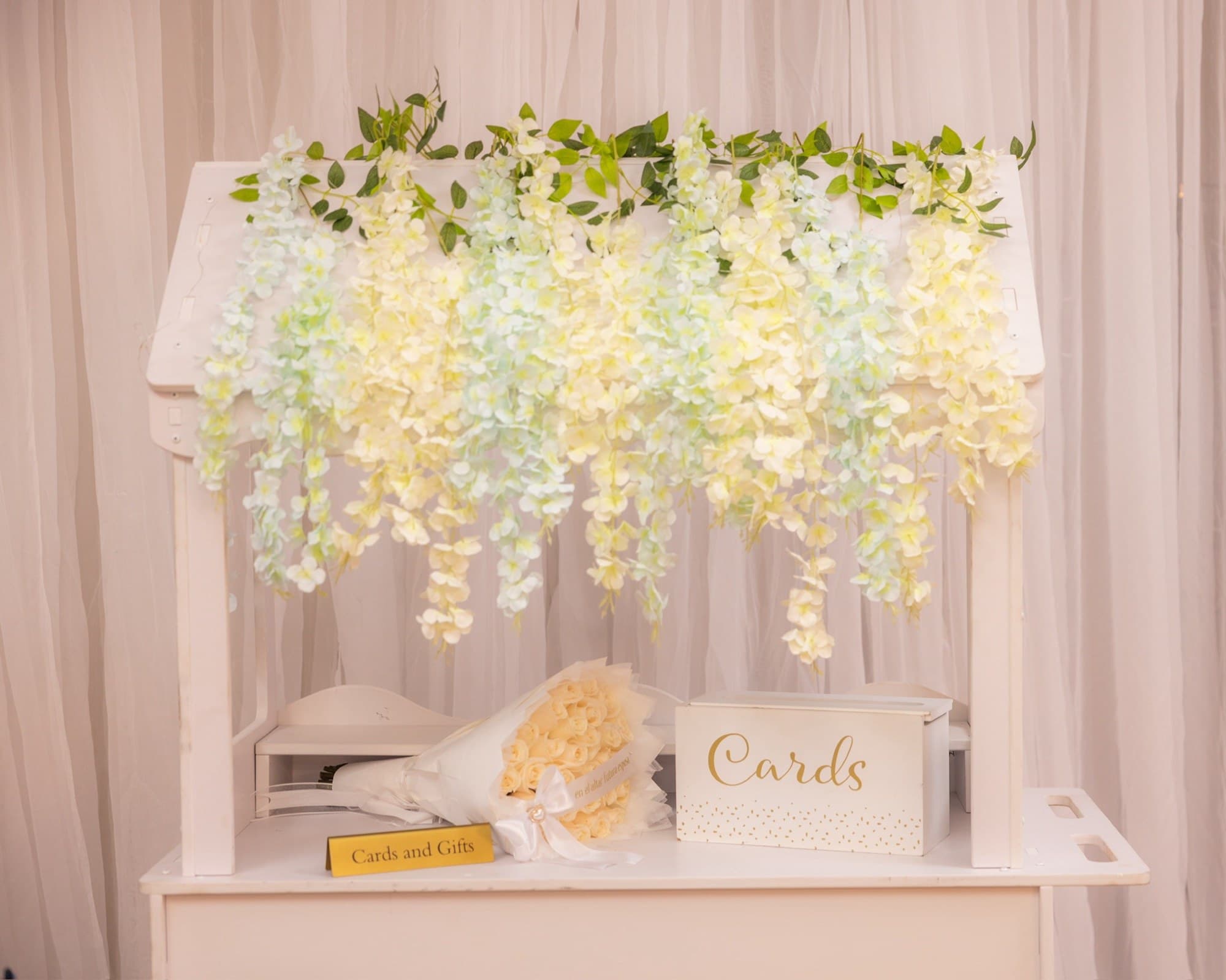 Cards and gifts table with cascading wisteria florals